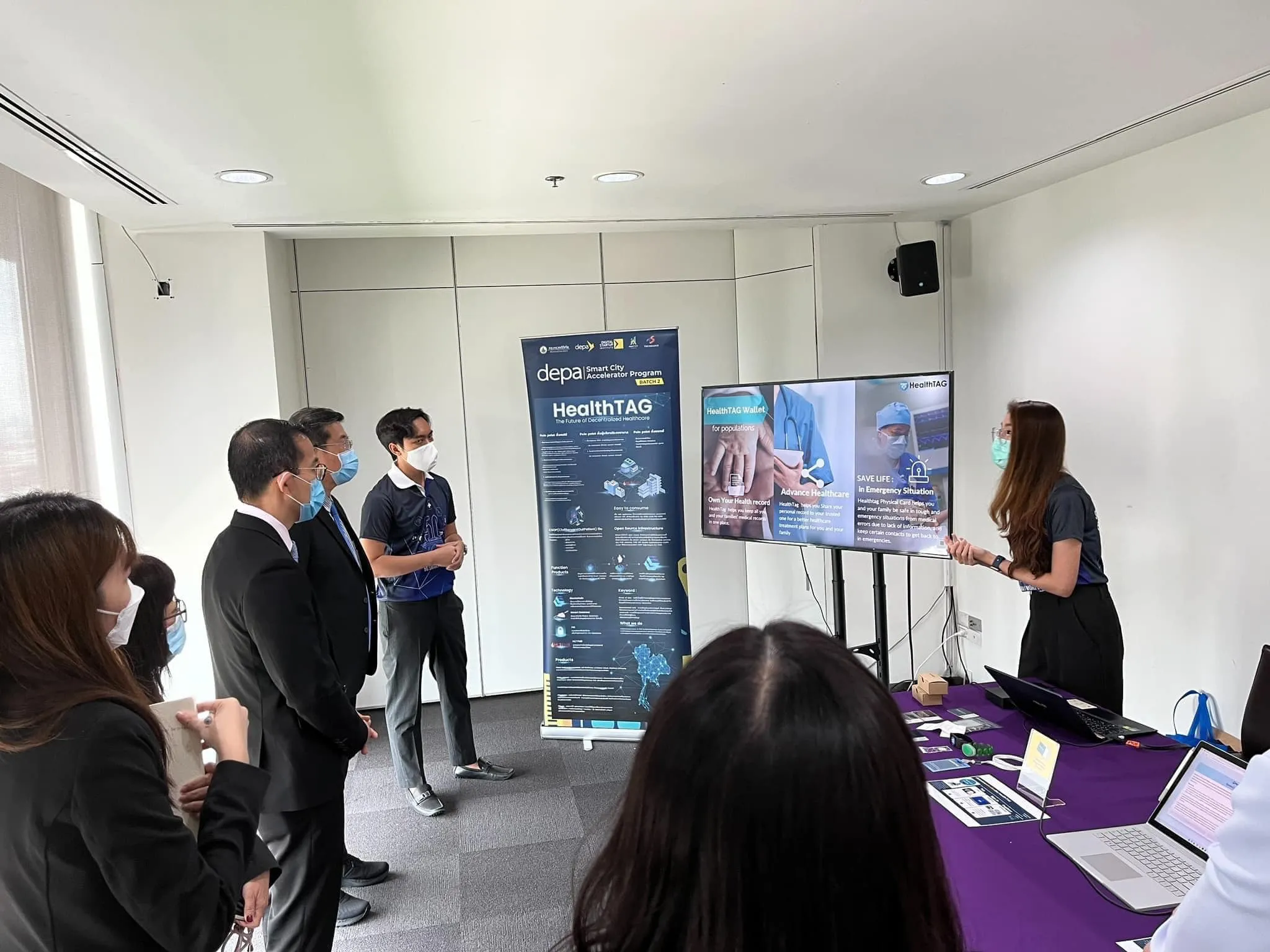 Tan Tock Seng Hospital visitors listen to a HealthTAG presentation at Siriraj Medical Research Center